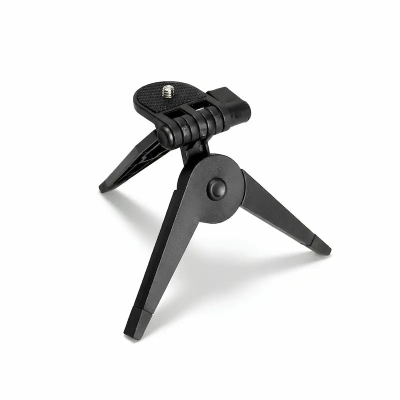 Un mini trépied appareil photo pliable sur fond blanc
