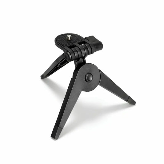 Un mini trépied appareil photo pliable sur fond blanc