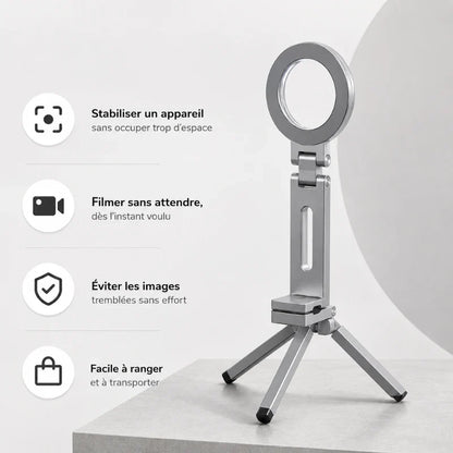 Mini trépied téléphone argenté déplié posé sur un cube gris, avec liste des avantages : stabilisation, filmage immédiat, images stables, compact
