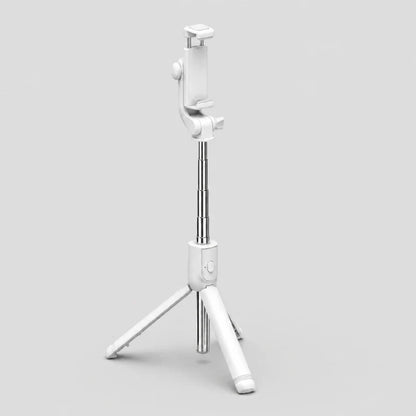 Mini trépied perche selfie blanc et argent extensible en vue trois quarts, support téléphone blanc, trois pieds déployés, sur fond gris clair