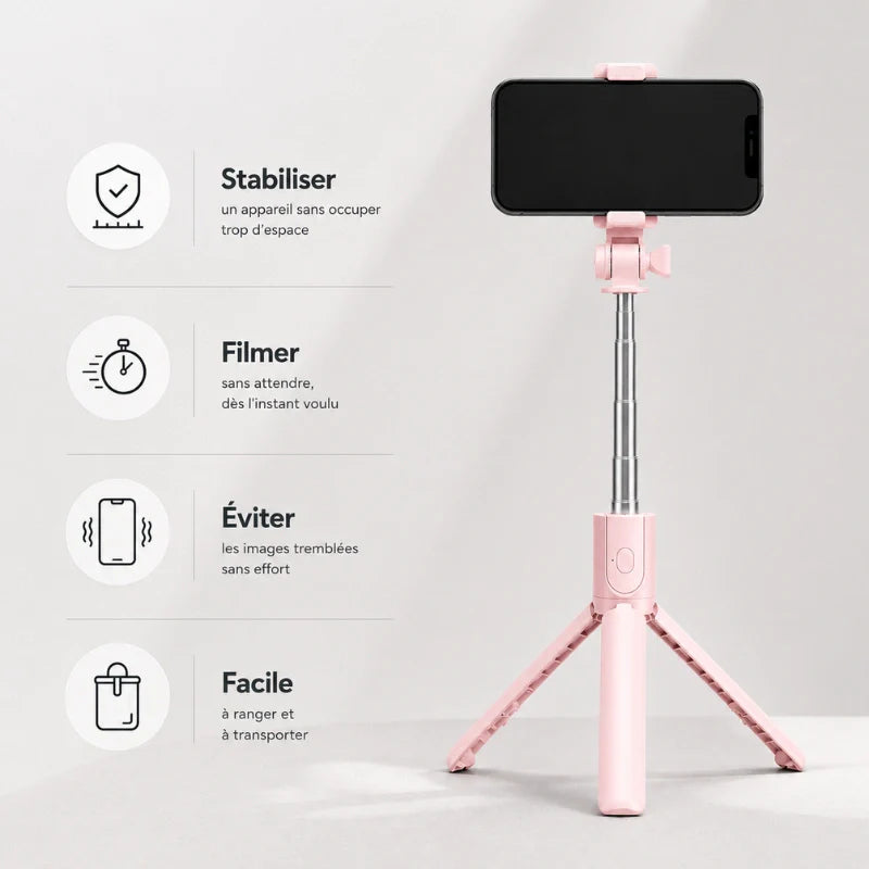 Mini trépied rose déplié avec un smartphone noir dans le support sur fond gris clair, avec liste des utilisations : stabiliser, filmer, éviter les tremblements, facile à ranger
