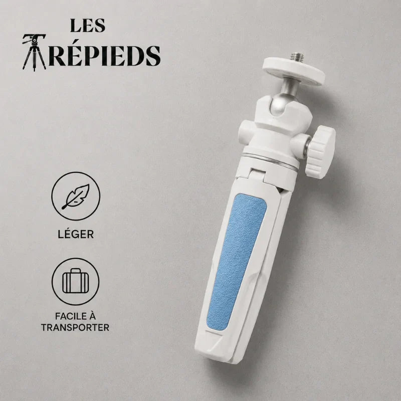Mini trépied blanc et bleu plié à plat avec logo Les Trépieds sur fond gris béton, léger et facile à transporter