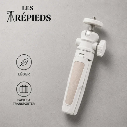 Mini trépied beige replié posé à plat sur fond gris, logo Les Trépieds, avec les mentions léger et facile à transporter