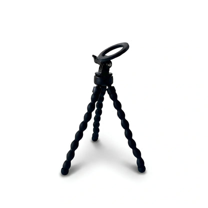 Mini trépied flexible magnétique noir avec support magnétique rond et pince en haut, trois jambes articulees en boules noires, sur fond blanc
