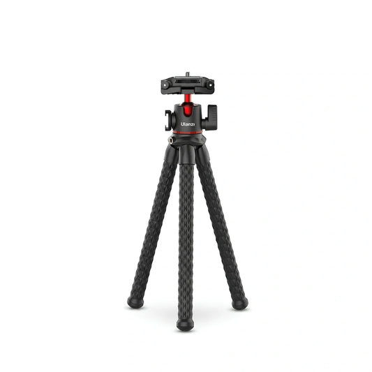Trépied flexible noir avec trois pieds ondulés texturés et rotule gimbal rouge et noire avec porte-accessoire en haut sur fond blanc